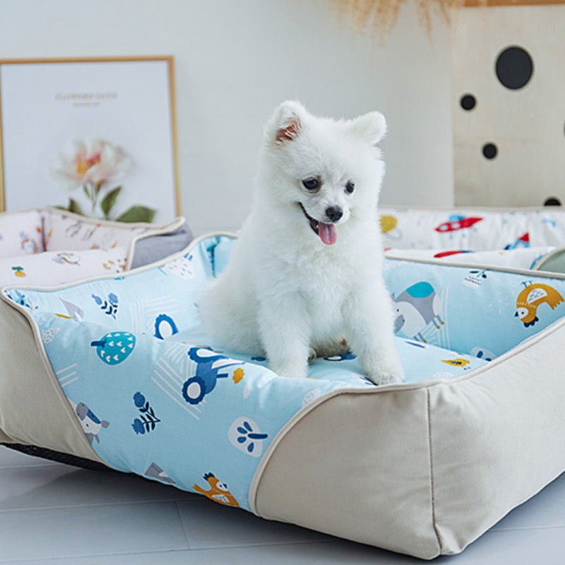Weiches Hundebett mit Nackenschutz und Cartoon-Muster